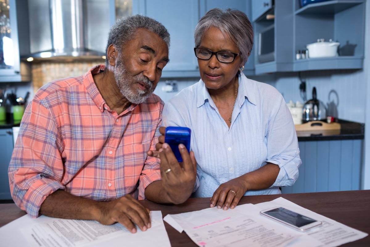 older couple looks at MYGA annuity and benefits 163032723