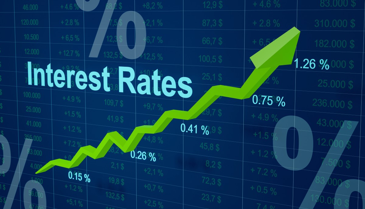 Green arrow over spreadsheet indicating interest rates rising483494924