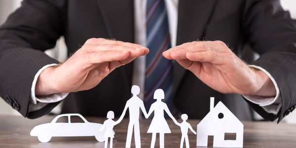 Insurance-agent-with-paper-cutout-family_101884982