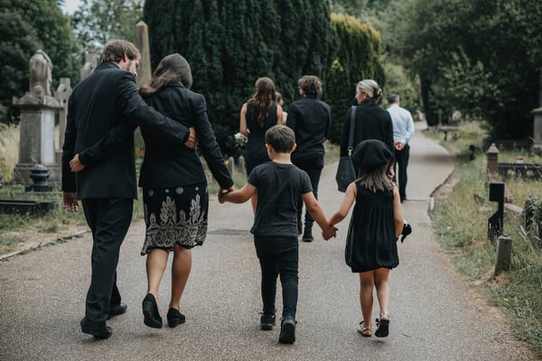 family-walking-to-burial
