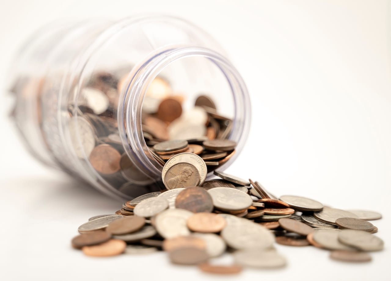 coins spilling from a jar