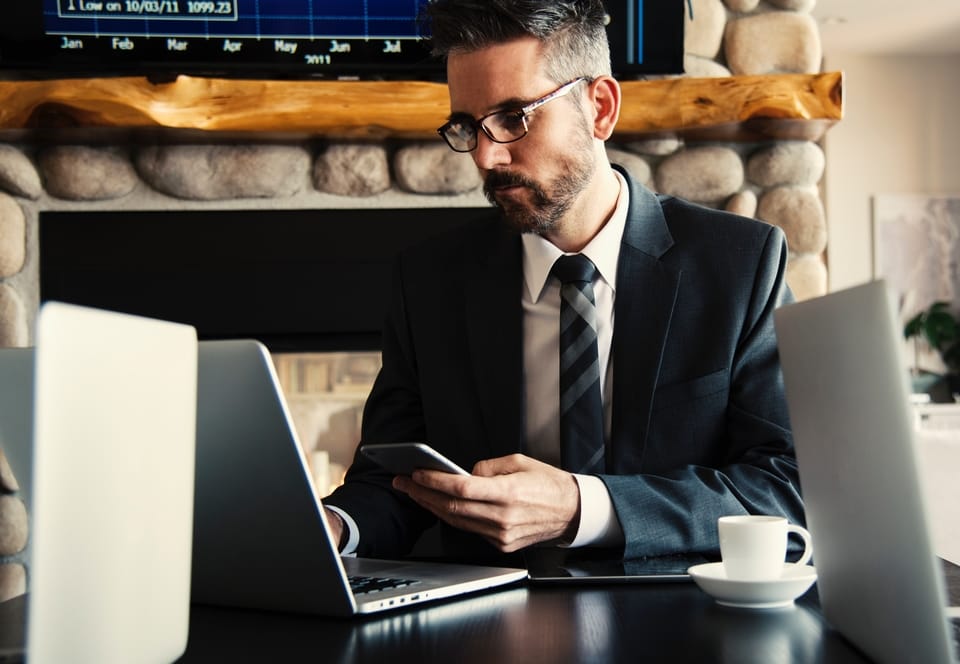 man-in-suit-working-on-laptop