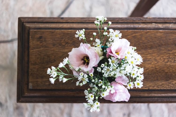 wood-casket-with-flowers