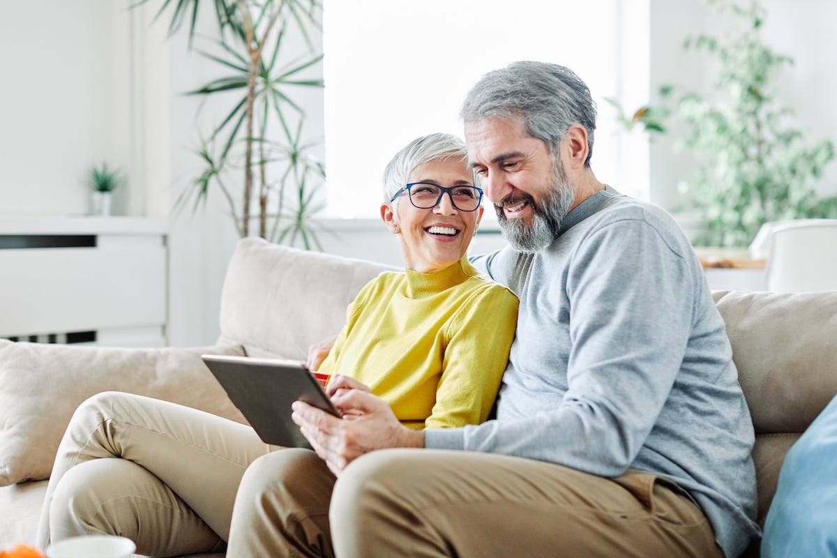 couple-using-social-media-on-a-tablet