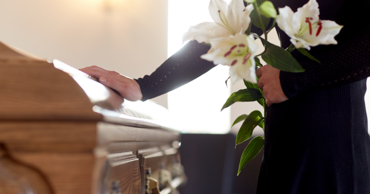 Placing Hand on Casket
